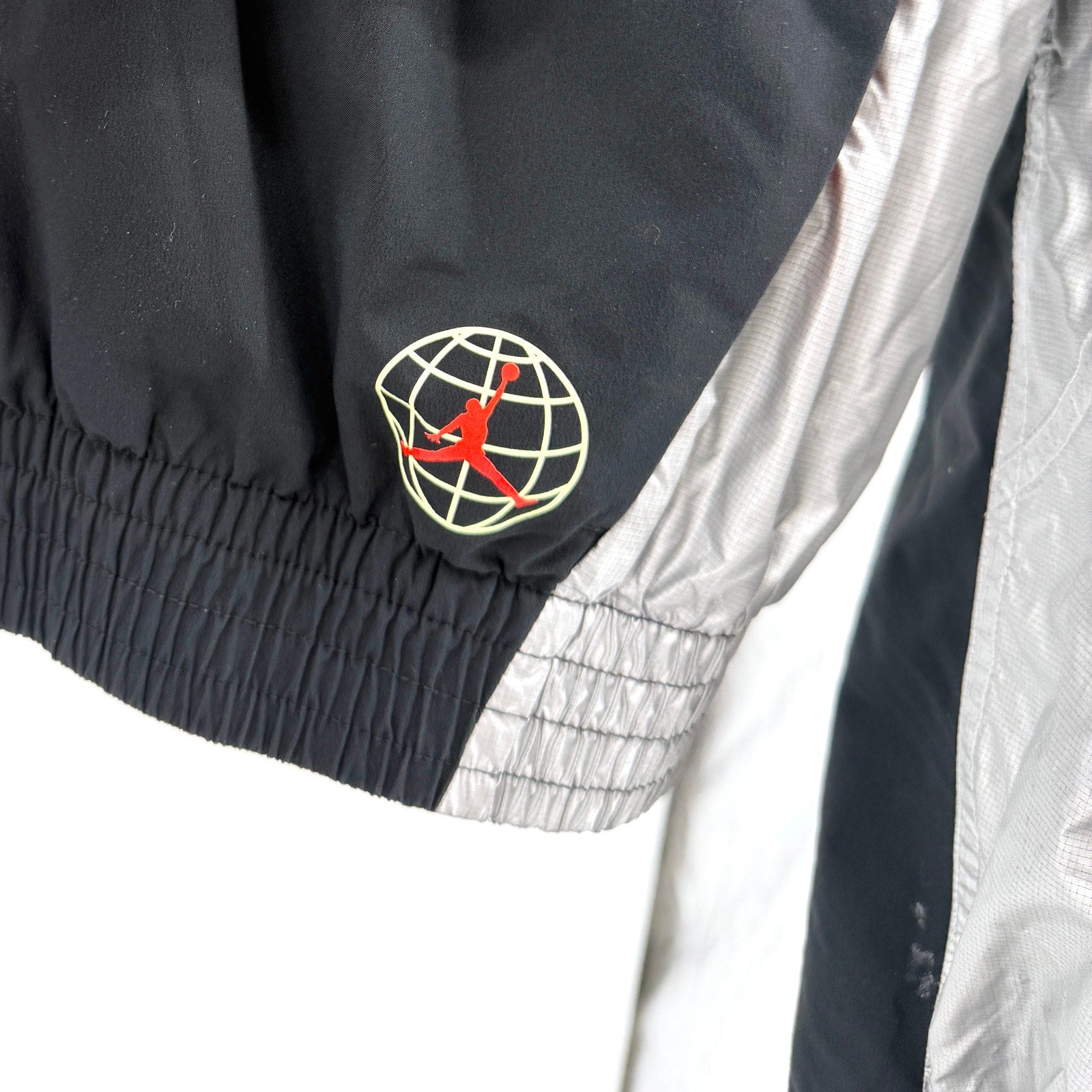 Air Jordan Black Silver Asymmetrical Zip Cropped Track Jacket