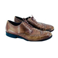 Pair of brown leather dress shoes on a white background