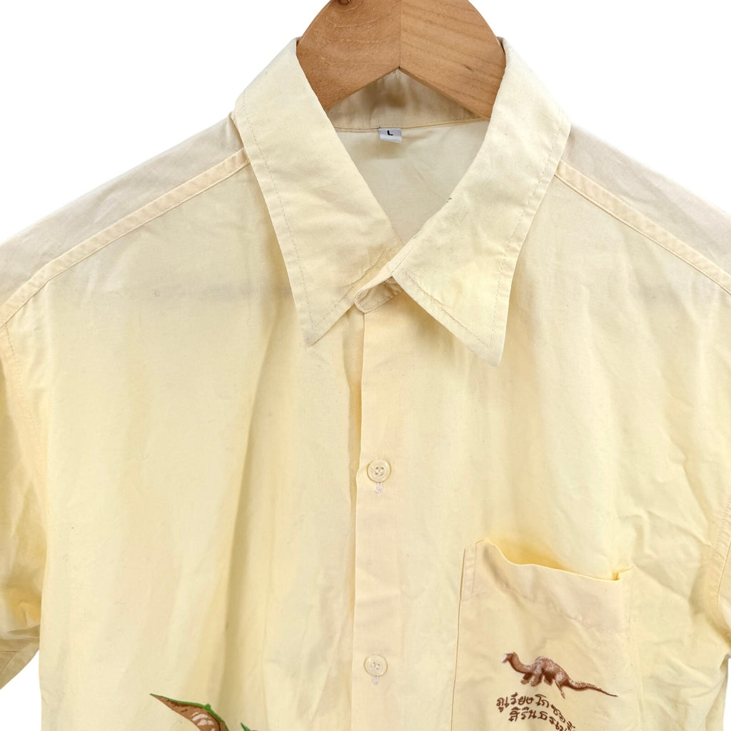 Vintage 90s Pastel Yellow 100% Cotton Dinosaur Border Print Short Sleeve Shirt
