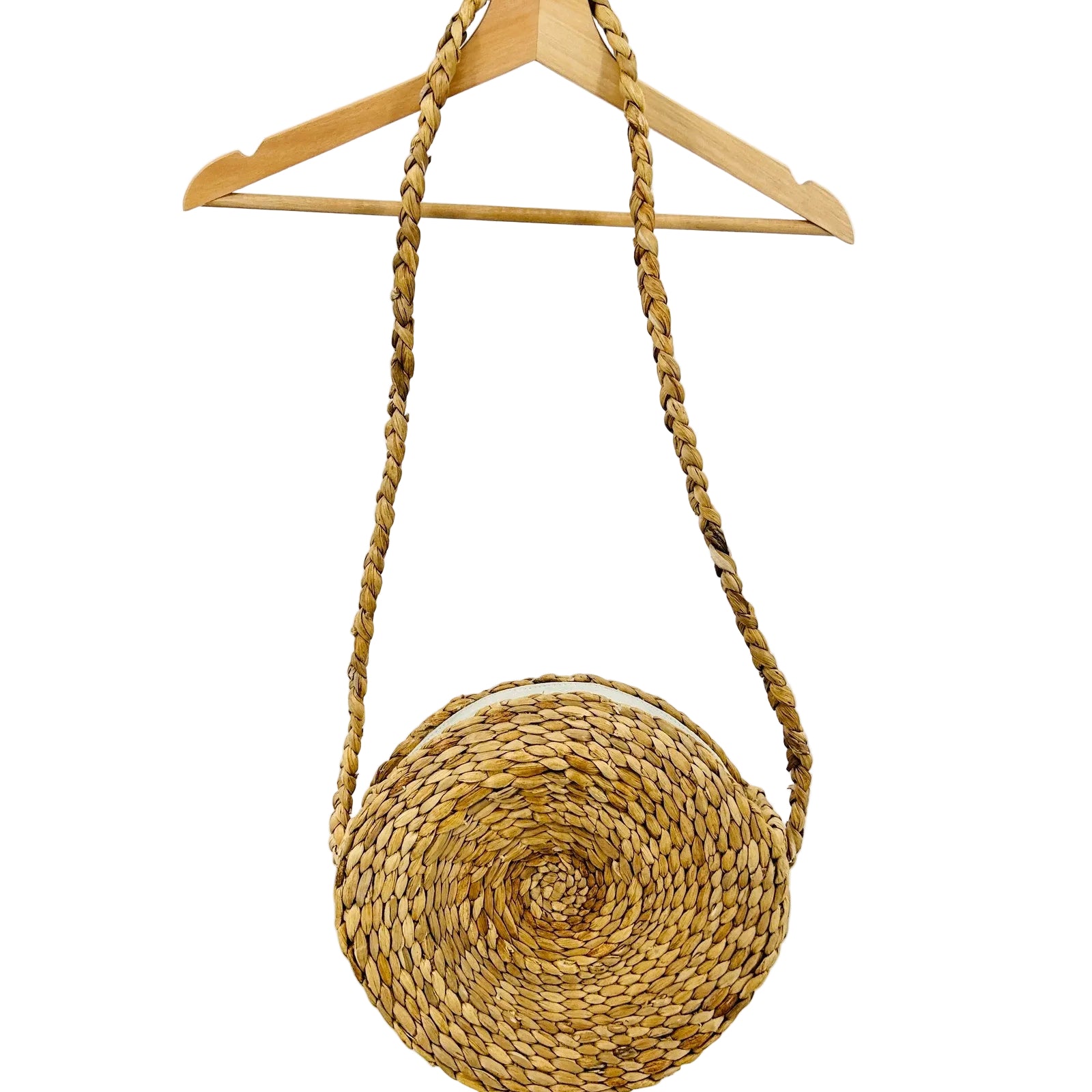 Woven handbag with a rope strap on a wooden hanger against a white background